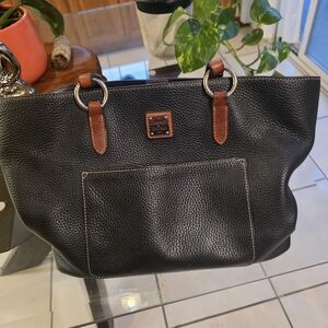 Dooney & Bourke Tammy Black Pebbled Leather Tote with Brown Trim.